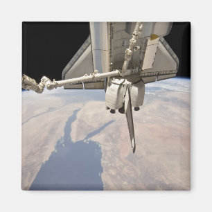 The aft section of the docked space shuttle magnet