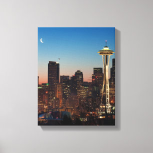 The American flag flies between the rising moon Canvas Print