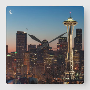 The American flag flies between the rising moon Square Wall Clock