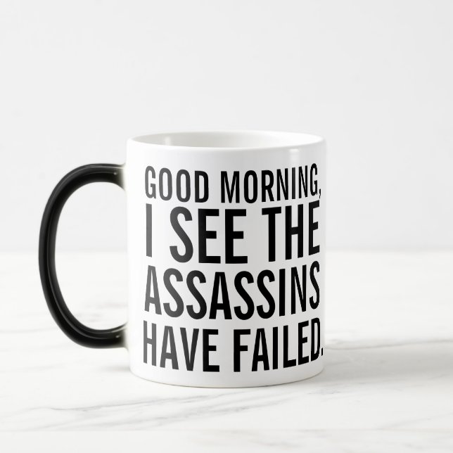 "the assassins have failed" coffee mug (Left)