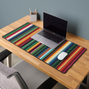 The background theme has bright colour stripes desk mat
