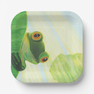 The big-eyed green frog behind lily pad paper plate