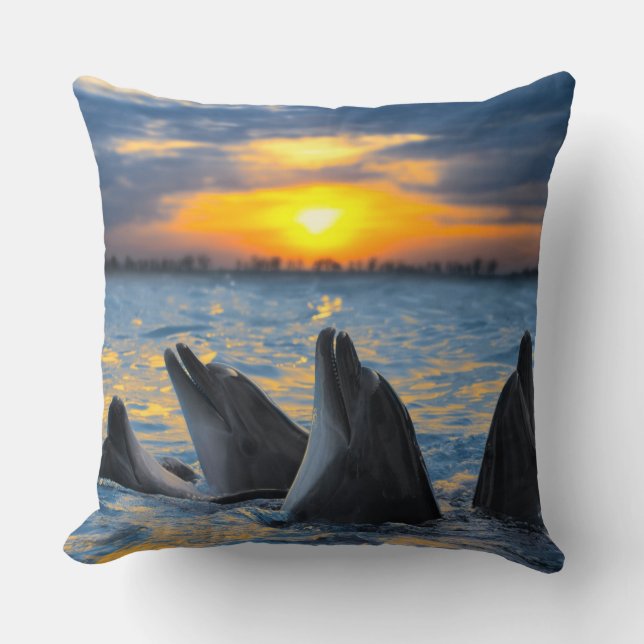 The bottle-nosed dolphins in sunset light throw pillow (Front)