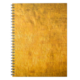 The brass concrete surface glows from the walls of notebook
