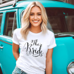 The Bride Black Script Personalized Wedding T-Shirt<br><div class="desc">The Bride wedding shirt features modern black swirling calligraphy script writing with elegant custom Future Mrs text that you can personalize with a last name on the reverse side. See our coordinating bridal party designs!</div>