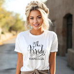 The Bride Black Script Personalized Wedding T-Shirt<br><div class="desc">Wedding The Bride shirt features modern black swirling calligraphy script writing with elegant custom first name text that you can personalize. See our coordinating bridal party designs!</div>