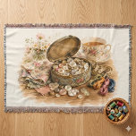 The Button Tin Throw Blanket<br><div class="desc">A cozy cottagecore sewing scene unfolds through an open vintage button tin filled with pearly buttons, surrounded by floral scraps, embroidery floss, a measuring tape, fresh garden blossoms, and a delicate teacup. The artwork has a soft watercolor style with warm golden browns, creamy ivory, dusty rose, muted sage, faded blue,...</div>