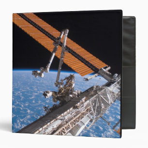 The Canadarm2 and solar array panel wings Binder