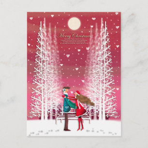 The Christmas image of the happy couple Holiday Postcard