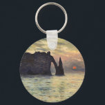 The Cliff Etretat, Sunset by Claude Monet Keychain<br><div class="desc">The Cliff, Etretat, Sunset (1883) by Claude Monet is a vintage impressionist fine art nautical painting. The sun is low in the sky over the ocean. A maritime seascape featuring a rocky outcrop near the shore at Etretat, France. About the artist: Claude Monet (1840-1926) was a founder of the French...</div>