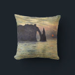 The Cliff Etretat, Sunset by Claude Monet Throw Pillow<br><div class="desc">The Cliff, Etretat, Sunset (1883) by Claude Monet is a vintage impressionist fine art nautical painting. The sun is low in the sky over the ocean. A maritime seascape featuring a rocky outcrop near the shore at Etretat, France. About the artist: Claude Monet (1840-1926) was a founder of the French...</div>