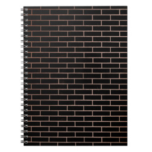 The dark black brick wall has a rough surface as a notebook
