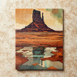 The Desert Monument Landscape  Jigsaw Puzzle<br><div class="desc">This modern art jigsaw puzzle features an abstract rugged desert landscape in deep burnt red, orange, brown, teal, cream, and black. At the center rises a bold rocky butte reminiscent of the American Southwest, set against a dramatic sky and reflected in stylized water below. The artwork blends contemporary minimalism with...</div>