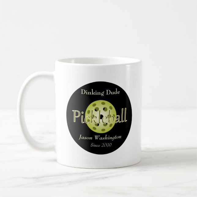 The Dinking Dude Guy Pickleball Ball Coffee Mug (Left)