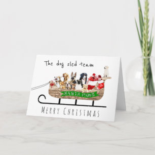 The dog sled team dogs in Santa sleigh Card