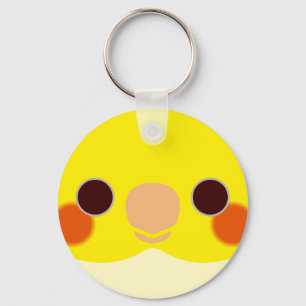 The face of a lutino cockatiel keychain