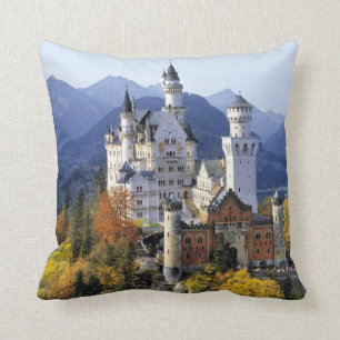 The fanciful Neuschwanstein is one of three Throw Pillow