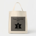 The Flame & Star - Tote Bag<br><div class="desc">This image is a flame from a candle. A star around the flame represents Hanukkah. Done in a black tattoo. A black backround was also added. "Happy Hanukkah 2014" is printed on this design. Customize with your own words. These totes are available in assorted styles,  colours and sizes.</div>