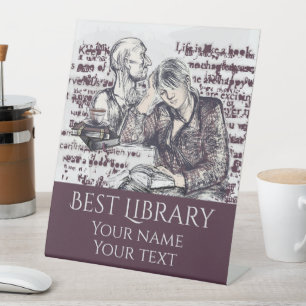 The girl reading a book pedestal sign