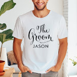 The Groom Black Script Personalized Wedding T-Shirt<br><div class="desc">Wedding Groom shirt features modern black swirling calligraphy script writing with elegant custom first name text that you can personalize. See our coordinating bridal party designs!</div>