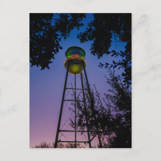 The Gruene water tower with the purple evening sky Postcard