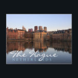 The Hague skyline in the Netherlands Postcard<br><div class="desc">Postcard of the modern skyline of the city centre of The Hague together with historic Mauritshuis museum and the seat of government Parliament building with reflection in the still water of Hofvijver lake at dusk in The Netherlands,  with the text; 'The Hague,  Netherlands'.</div>