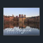 The Hague skyline in the Netherlands Postcard<br><div class="desc">Postcard of the modern skyline of the city centre of The Hague together with historic Mauritshuis museum and the seat of government Parliament building with reflection in the still water of Hofvijver lake at dusk in The Netherlands,  with the text; 'The Hague,  Netherlands'.</div>