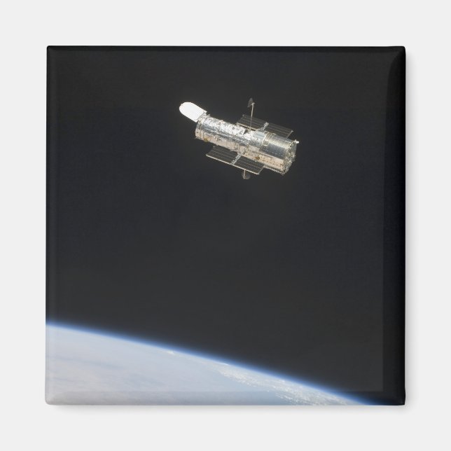 The Hubble Space Telescope in orbit above Earth 2 Magnet (Front)