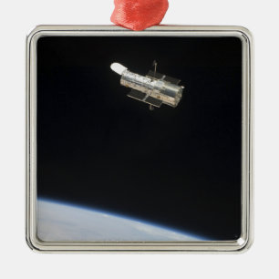 The Hubble Space Telescope in orbit above Earth 2 Metal Ornament