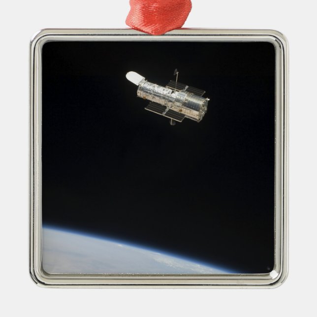 The Hubble Space Telescope in orbit above Earth 2 Metal Ornament (Front)