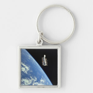 The Hubble Space Telescope with a blue earth Keychain