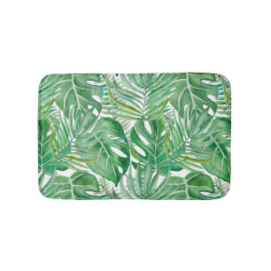 The huge leaves of palm trees and monstera bath mat