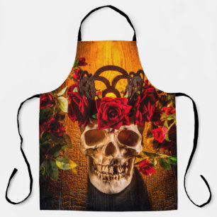 The human skull on the black table lies in the ros apron