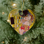 The Kiss by Gustav Klimt, Vintage Art Nouveau Ceramic Ornament<br><div class="desc">The ultimate painting of love, a beautiful design to celebrate Valentine's Day with! The Kiss (detail) (1907-1908) by Gustav Klimt is a vintage Victorian Era Symbolism fine art love and romance painting featuring a romantic couple in various shades of gold, patterns and symbols, sharing a kiss against a bronze background....</div>