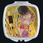 The Kiss by Gustav Klimt, Vintage Art Nouveau Mirror For Makeup<br><div class="desc">The ultimate painting of love, a beautiful design to celebrate Valentine's Day with! The Kiss (detail) (1907-1908) by Gustav Klimt is a vintage Victorian Era Symbolism fine art love and romance painting featuring a romantic couple in various shades of gold, patterns and symbols, sharing a kiss against a bronze background....</div>