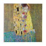 The Kiss by Gustav Klimt, Vintage Art Nouveau Tile<br><div class="desc">The Kiss (Der Kuss) (1907/08) by Gustav Klimt is probably his most famous work. Klimt began work on it in 1907 and it is the highpoint of his so-called 'Golden Period'. The Kiss is a vintage Victorian Era Symbolism fine art love and romance painting featuring a romantic couple in various...</div>