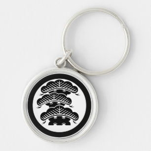 The Left Three-Story Pine with Araeda in the Circl Keychain