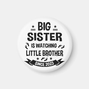 The little sister takes care of the big brother in magnet
