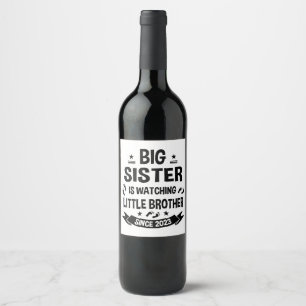 The little sister takes care of the big brother in wine label