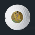 The Lovers Kissing Embrace by Gustav Klimt Golf Balls<br><div class="desc">Sunlight glints off the swirling golden embrace that surrounds the lovers in Gustav Klimt's masterpiece, The Kiss. The scene is a paradox of intimacy and isolation. The couple stands on a precipice, a field of colourful flowers at their feet, yet they are oblivious to the world around them. Their gazes...</div>