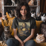 The Meow Lisa T-Shirt<br><div class="desc">The Meow Lisa T-Shirt - Ever wondered what’s the reason for that mysterious Mona Lisa smile? On second look we have the answer. This absolute masterpiece of a t shirt features the best known work of art in the world “brushing it off”, and having some quality time with a kitty....</div>