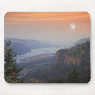 The moon hangs in the sky above the Vista Mouse Pad