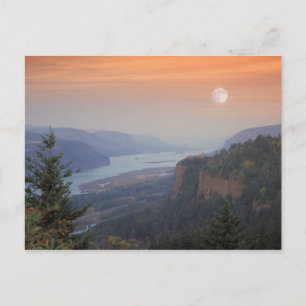 The moon hangs in the sky above the Vista Postcard