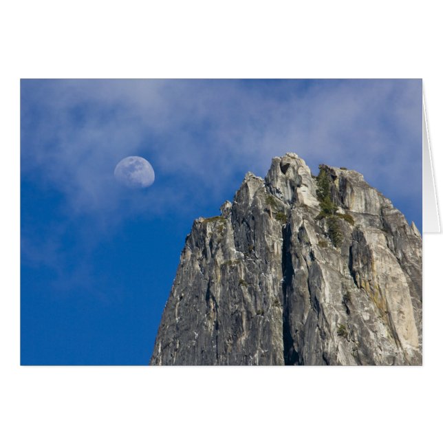 The moon rises and shines through the clouds (Front Horizontal)