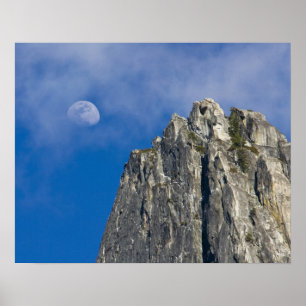 The moon rises and shines through the clouds poster