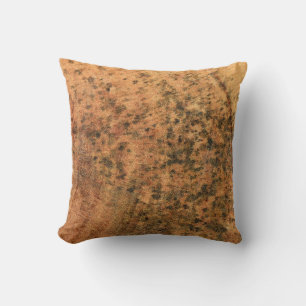 The mould that grows on the brown wood surface is throw pillow