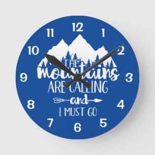 The Mountains Are Calling and I Must Go Blue White Round Clock