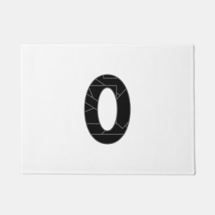 The number zero (0) in black doormat