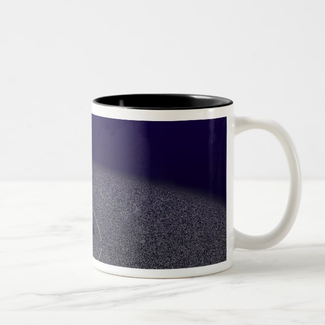 The orbit of the binary Kuiper Belt object Two-Tone Coffee Mug (Right)