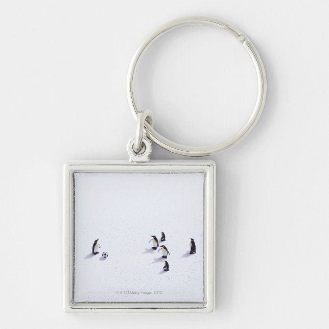 The penguins playing soccer keychain (Front)